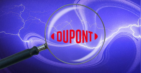 A magnifying glass hovers over the DuPont logo against a purple background.