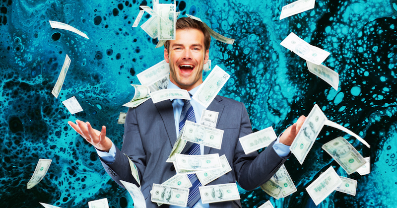 A man in a suit smiling while throwing money around against a blue background.